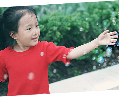 Girl Playing With Bubbles