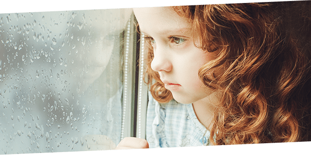 Girl looking out window